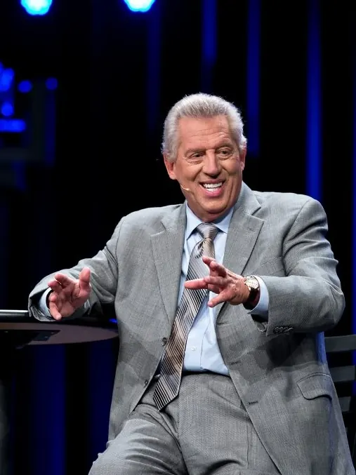 John C. Maxwell speaking on stage at Live2Lead