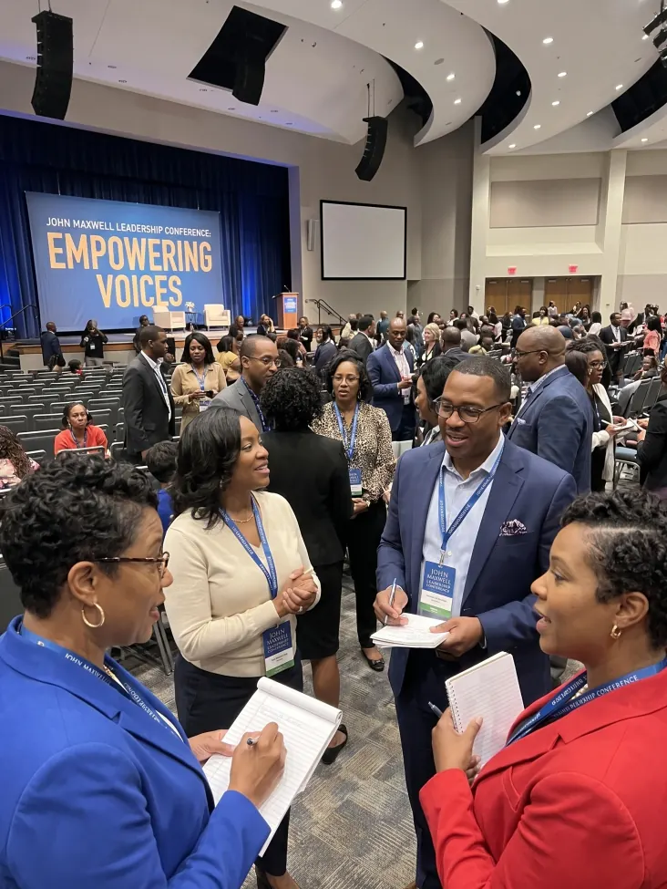 Delegates networking at a leadership conference